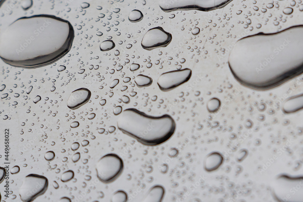 water drops on shiny metal after the rain has stopped, selective focus water drops on shiny metal after the rain has stopped, selective focus