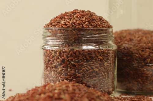 Navara rice is one of the many types of rice found in India, with a unique red color.. photo