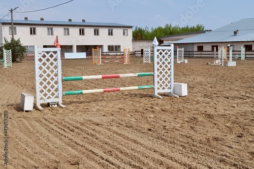 empty show jumping arena with obstacles, barriers and poles, horse riding, equestrian sport and horses concept, competition field, background wallpaper 