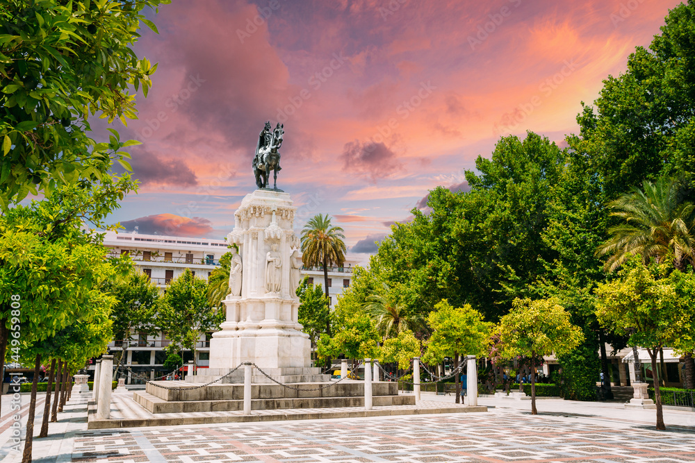 Seville, Spain. Monument to King Saint Ferdinand at New Square Plaza Nueva in Seville, Spain. Altered Sunset Sunrise Sky