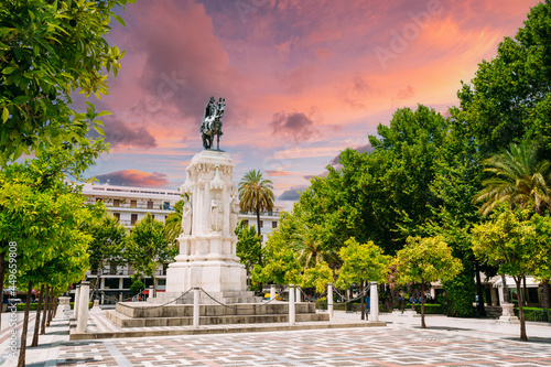 Seville  Spain. Monument to King Saint Ferdinand at New Square Plaza Nueva in Seville  Spain. Altered Sunset Sunrise Sky