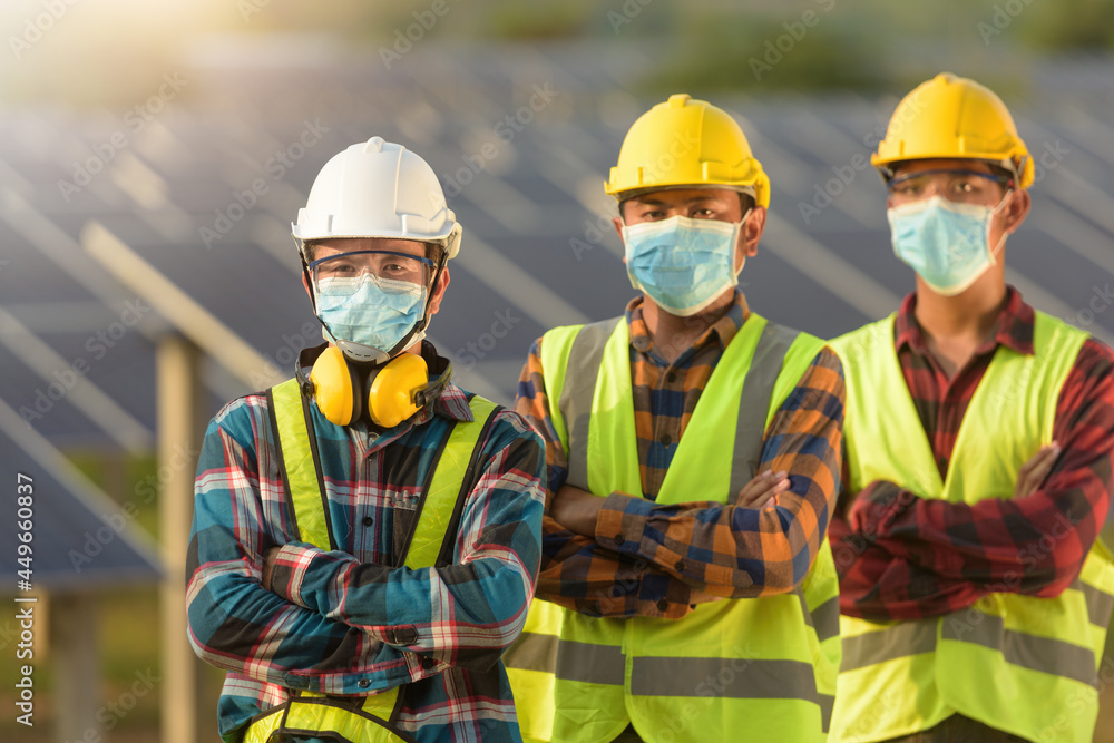 Portrait of three engineers on a construction site wearing face masks, Thailand Portrait of three engineers on a construction site wearing face masks, Thailand