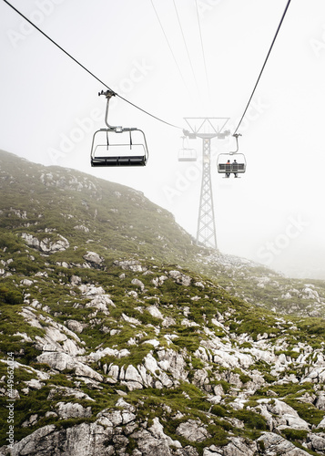 Sessellift im Nebel auf dem Weg zur Pizolhütte, Schweiz photo