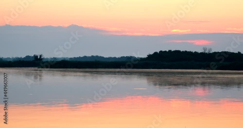 Wallpaper Mural Time lapse golden light sunrise in morning. Big sun with clouds sunset timelapse. Amazing light of nature near river or lake. Landscape Torontodigital.ca