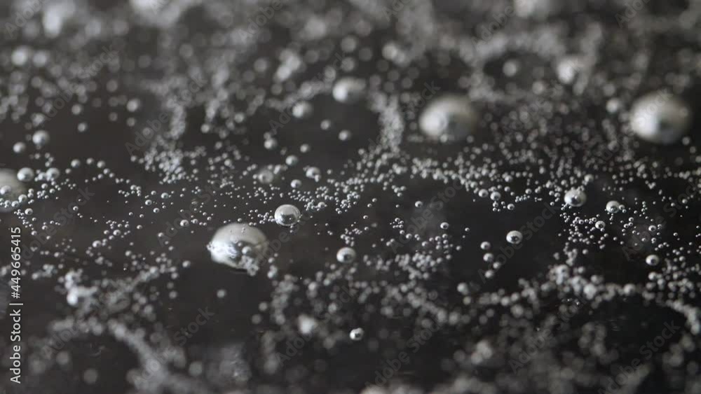 Slow motion shot of bubbles in boiling water, handheld shot. Slow motion shot of bubbles in boiling water, handheld shot.