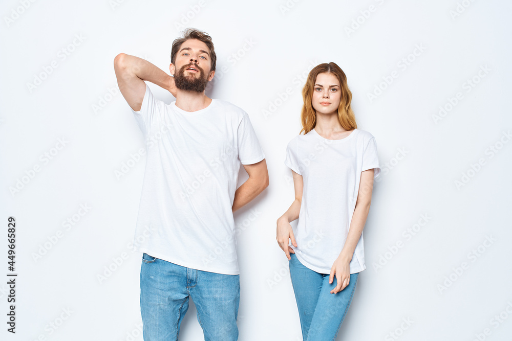 cheerful young couple in white t-shirts chatting moda Studio mockup cheerful young couple in white t-shirts chatting moda Studio mockup