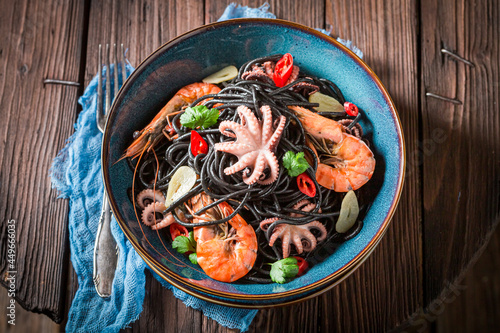 Tasty seafood black pasta with shrimp. Fresh pasta with seafood.