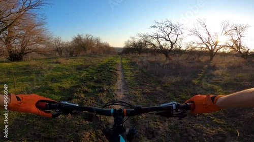 The cyclist rides along the path, video from the first person. Cycling. POV.
