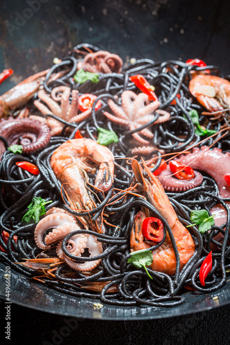 Tasty seafood black pasta with octopus. Fresh pasta with seafood.