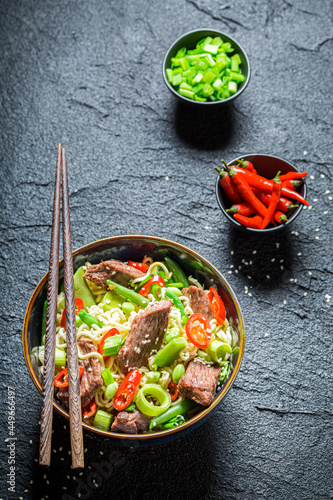 Spicy asian noodle with vegetables and beef. Classic seafood noodle.