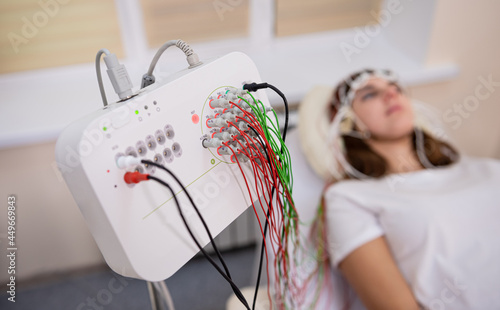 Patient brain testing using encephalography at medical center photo