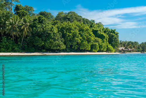 Coastline of the Togian Island Batudaka in the Gulf of Tomini in Sulawesi. Guesthouses at the Island beach. It's a paradise for divers and snorkelers and offers an incredible diversity of species