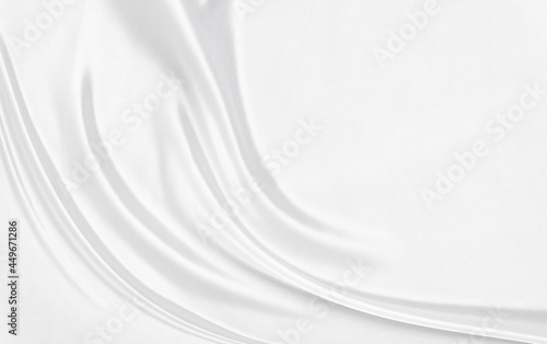 White gray satin texture that is white silver fabric silk background with beautiful soft blur pattern natural. © Kamjana