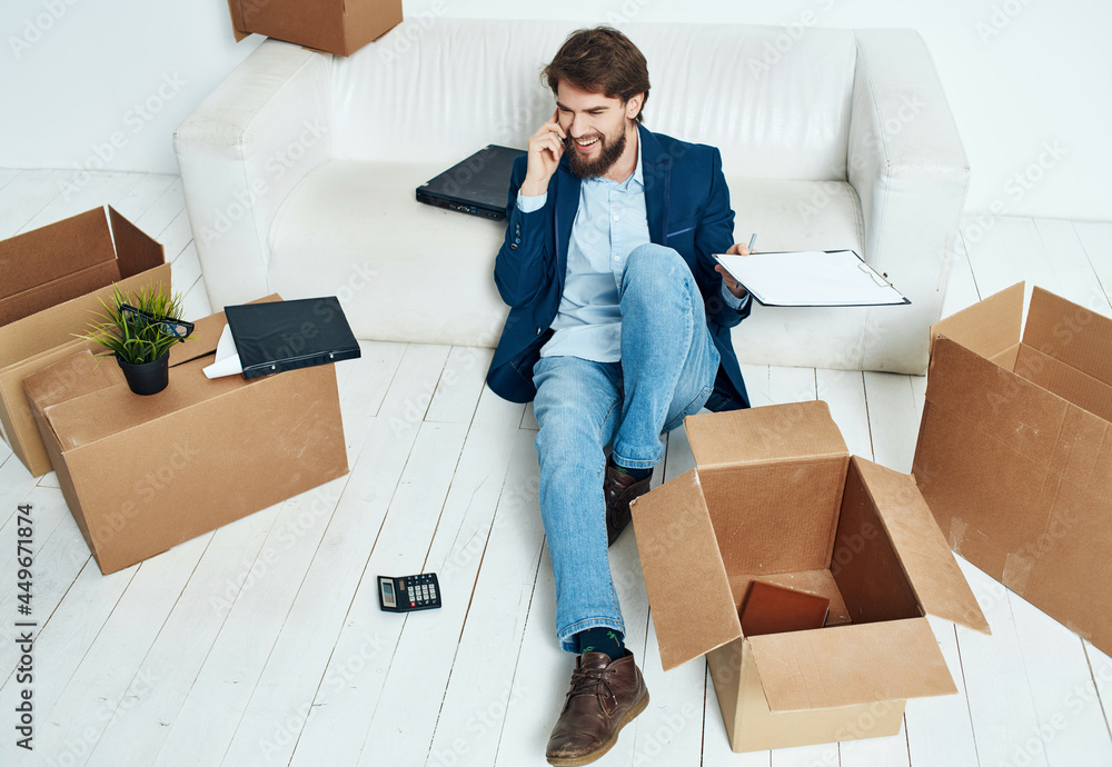business man boxes with things moving to a new place of work unpacking business man boxes with things moving to a new place of work unpacking