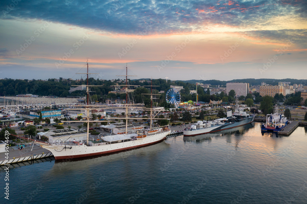 Harbor in Gdynia with the sailboat at sunset. Poland