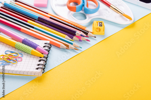 School supplies on a color background, table to view, copy space