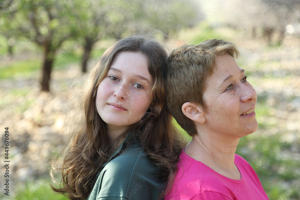 portrait of mom and teenage daughter outdoors portrait of mom and teenage daughter outdoors