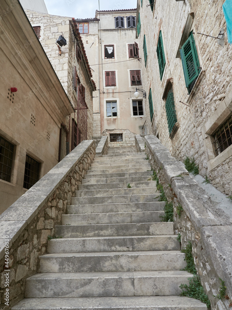 Steep stone stairs and historic tenement houses in the old town of Sibenik