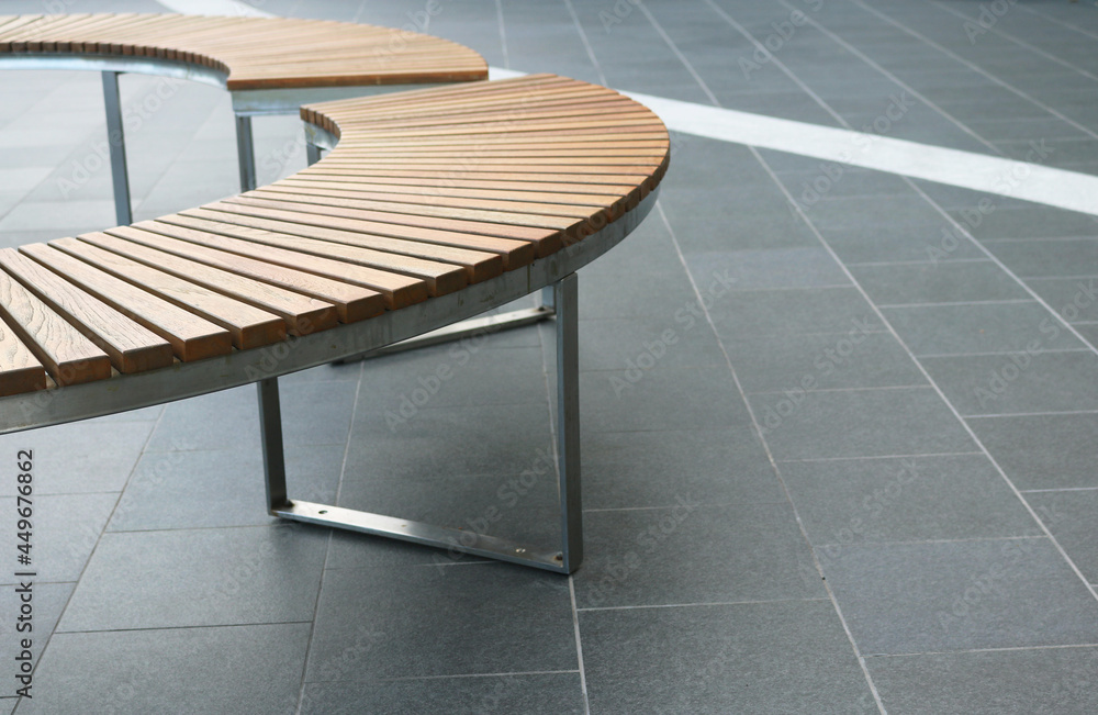 Wooden bench curved shape in the public plaza. Wooden bench curved shape in the public plaza.