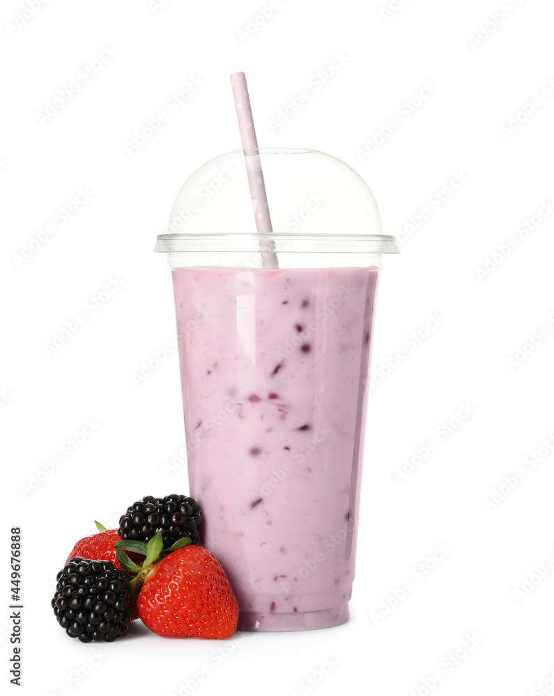 Delicious smoothie with straw in plastic cup and fresh berries on white background Delicious smoothie with straw in plastic cup and fresh berries on white background