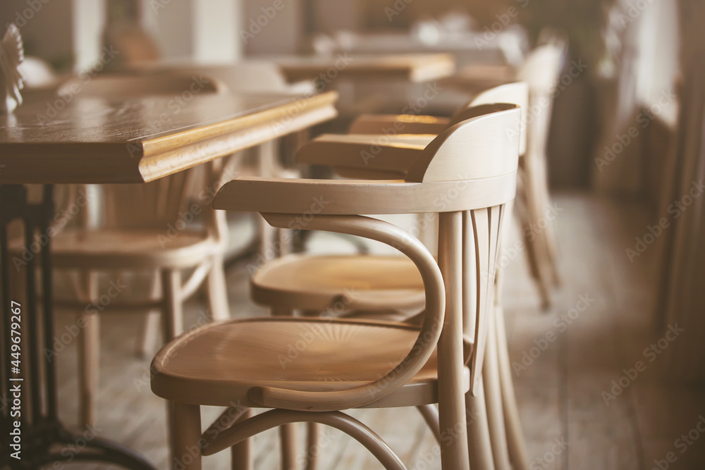 The cozy cafe has beautiful elegant wooden tables and chairs, but there are no visitors. Restrictions due to the pandemic. The cozy cafe has beautiful elegant wooden tables and chairs, but there are no visitors. Restrictions due to the pandemic.