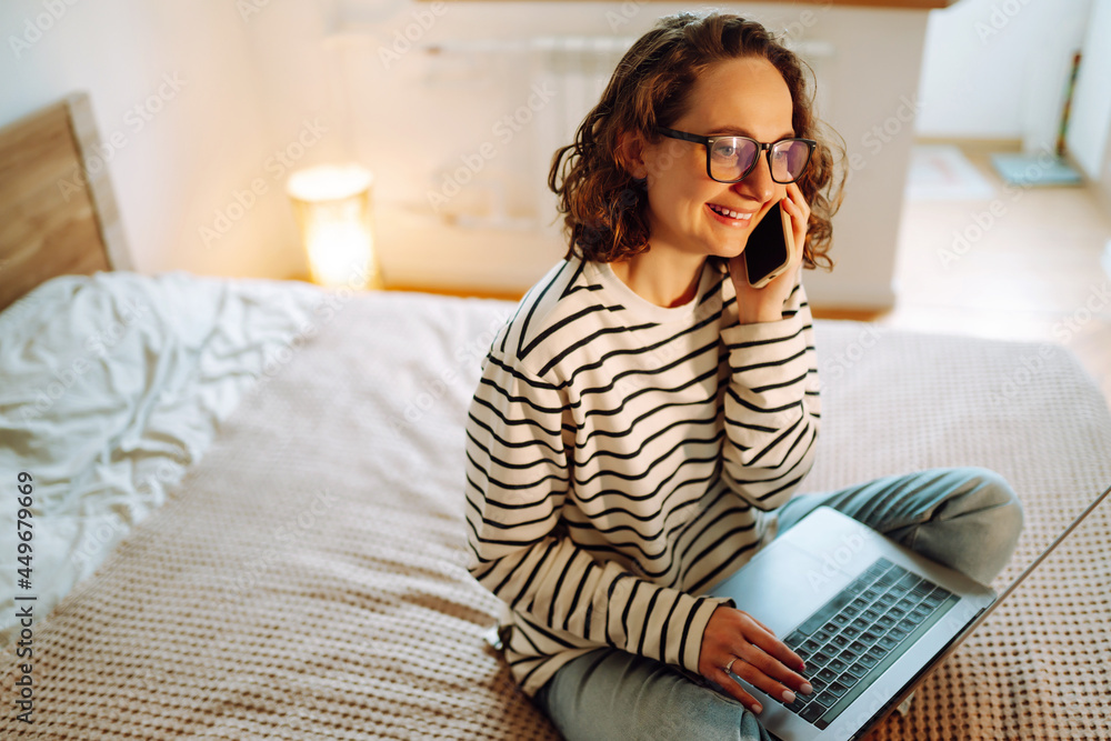 Young woman working online or studying and learning while using notebook at home. Technology, freelance, shopping online, remote work, E learning concept. Young woman working online or studying and learning while using notebook at home. Technology, freelance, shopping online, remote work, E learning concept.