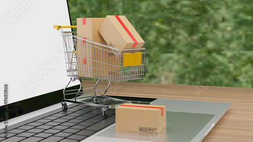 3D rendering Brown paper boxs in a shopping cart with laptop on wood table background.online shopping and delivery service concept.