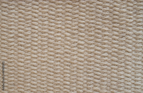Woolen woven rug on a loom close