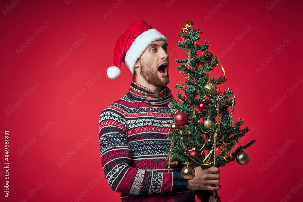emotional man Christmas tree toys New year red background emotional man Christmas tree toys New year red background