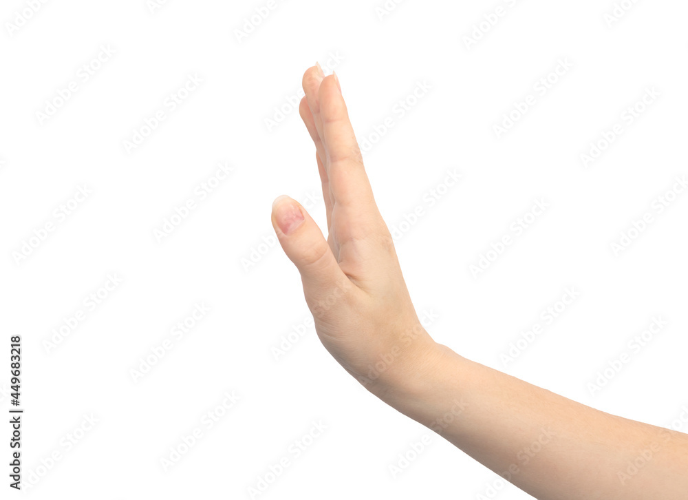 Hand gesture stop sign, isolated on a white background, young female hand close-up Hand gesture stop sign, isolated on a white background, young female hand close-up