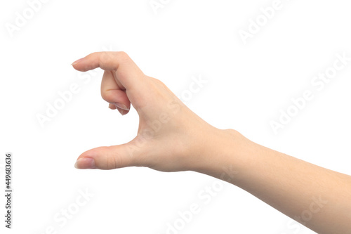 Hand gesture showing size, isolated on a white background, young female hand close-up
