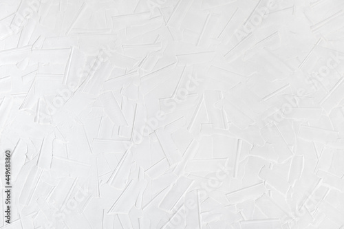 Fototapeta Naklejka Na Ścianę i Meble -  A pattern on the plaster made with a wide spatula. White wall, background image, texture