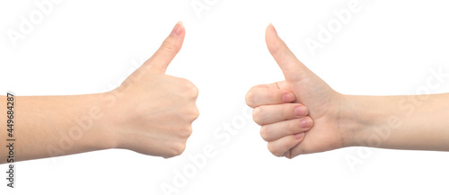 Thumb up gesture, like sign by young female, isolated on a white background photo