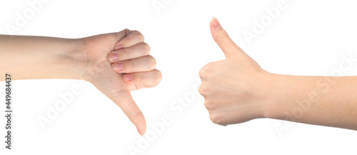 Like and dislike hand gesture, young female hand close-up, isolated on a white background