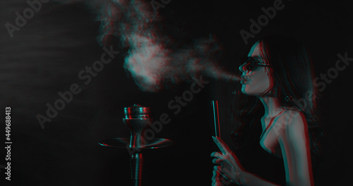 Hookah atmosphere. The girl enjoys smoking a hookah, sheesha. Place for your text. Photo in the glitch effect.