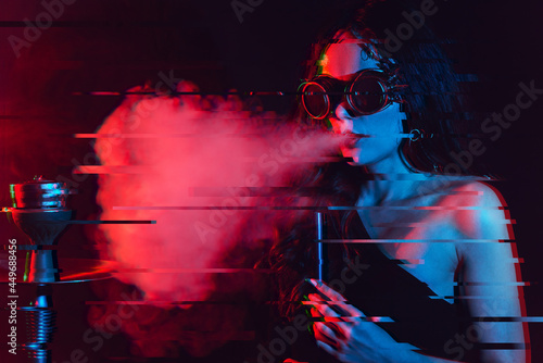 Hookah atmosphere. The girl enjoys smoking a hookah, sheesha. Surrealism