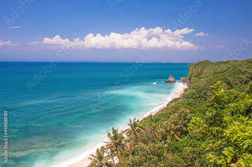 Fototapeta Naklejka Na Ścianę i Meble -  Beautiful tropical beach Bali, Indonesia. Seascape with a small island in the background.