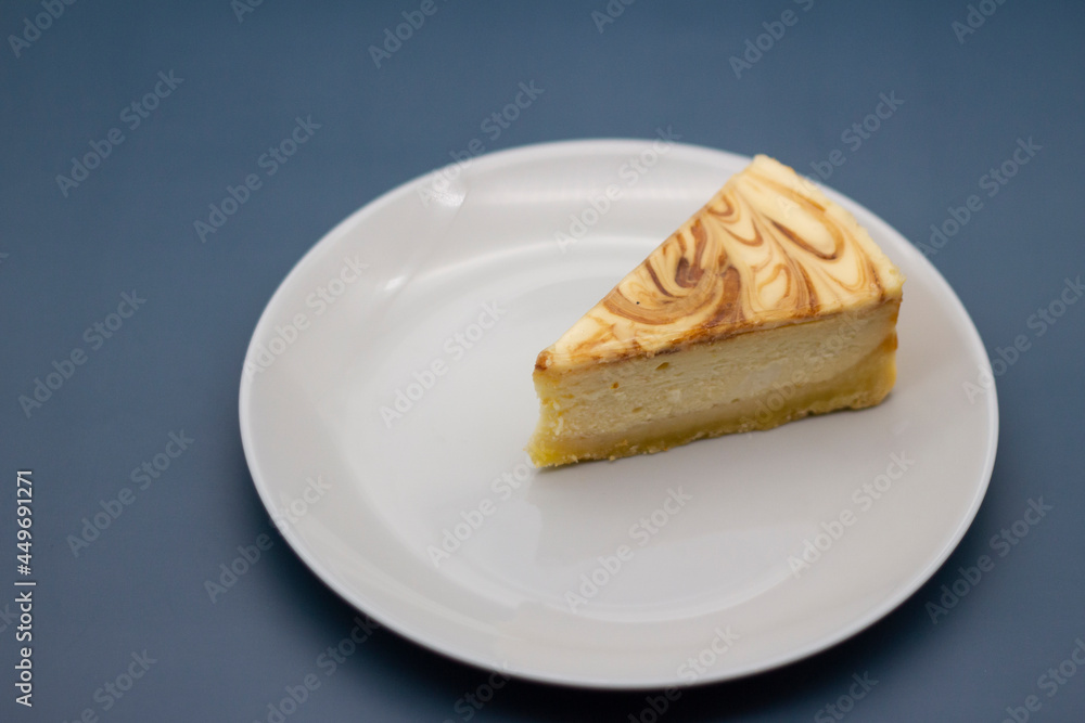 A piece of fresh tender caramel cheesecake on a plate A piece of fresh tender caramel cheesecake on a plate