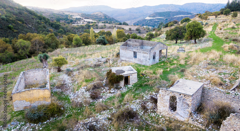 Ruins of stone buildings in abandoned Trozena village in Paphos area, Cyprus