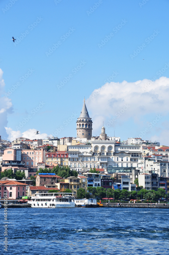 Panoramic views of the Galata Tower, residential buildings and the Bosphorus. July 11, 2021, Istanbul, Turkey. Summer day in Istanbul.