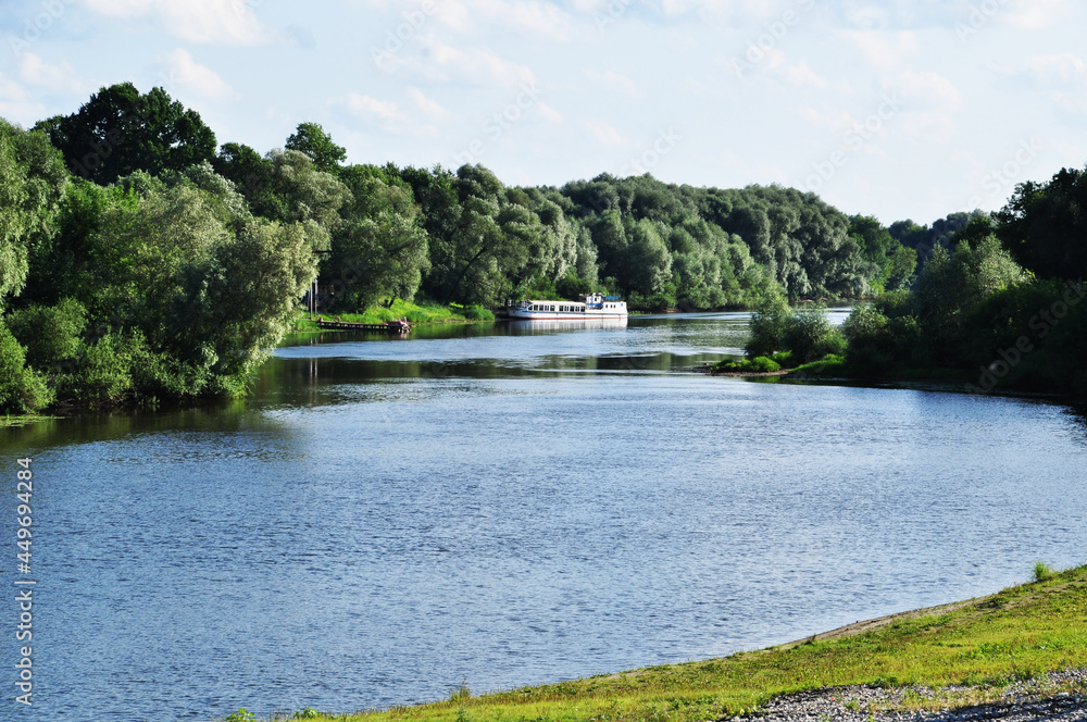 Fototapeta premium Panorama of the Desna River. View of the river, sailboat and coastline with trees.