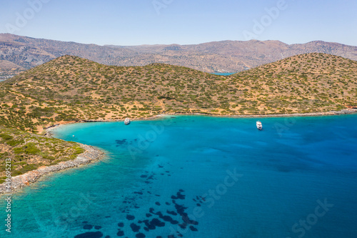 Fototapeta Naklejka Na Ścianę i Meble -  Aerial view of the dry Greek coastline in summer (Elounda, Crete)