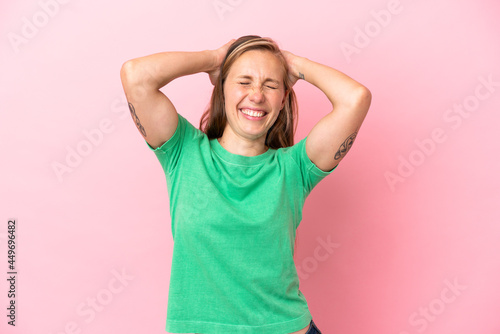 Young English woman isolated on pink background laughing © luismolinero