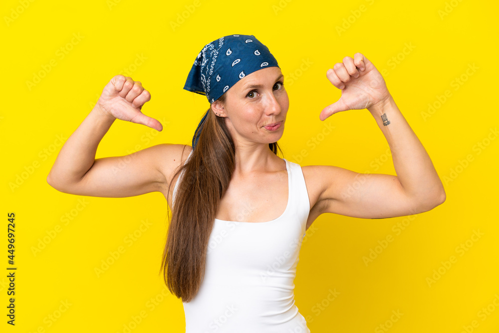 Young English woman isolated on yellow background proud and self-satisfied Young English woman isolated on yellow background proud and self-satisfied