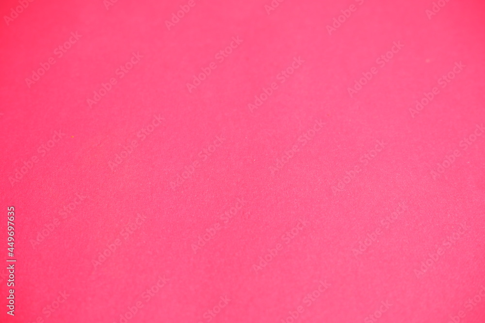 Pink background. The texture of the cardboard.