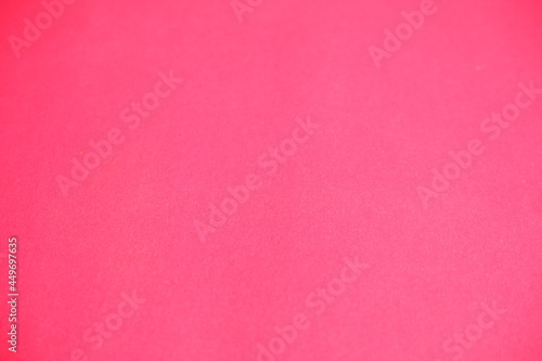 Pink background. The texture of the cardboard.
