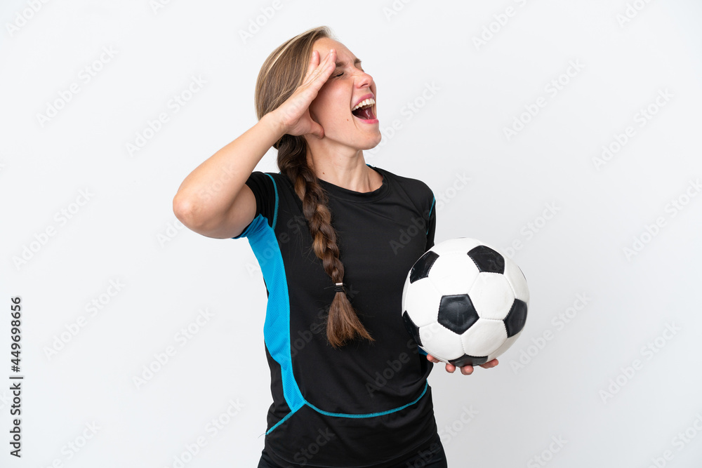Young football player woman isolated on white background smiling a lot Young football player woman isolated on white background smiling a lot