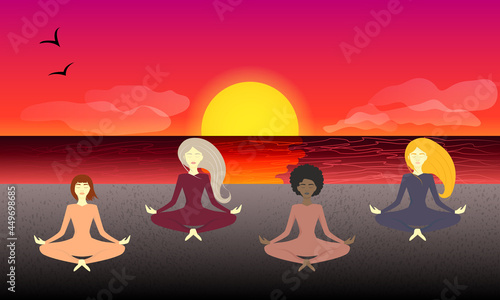 Group of women doing yoga in lotus position at sunset on the beach. Healthy lifestyle. Open air exercise.