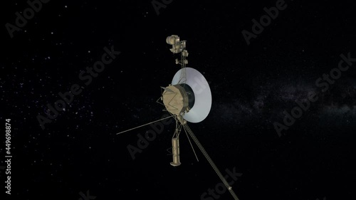 Voyager probe going away from the solar system in the milky way. Nasa's Voyager 1goes into deep space sending signals to Earth. photo