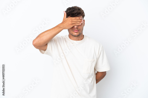 Young caucasian handsome man isolated on white background covering eyes by hands. Do not want to see something